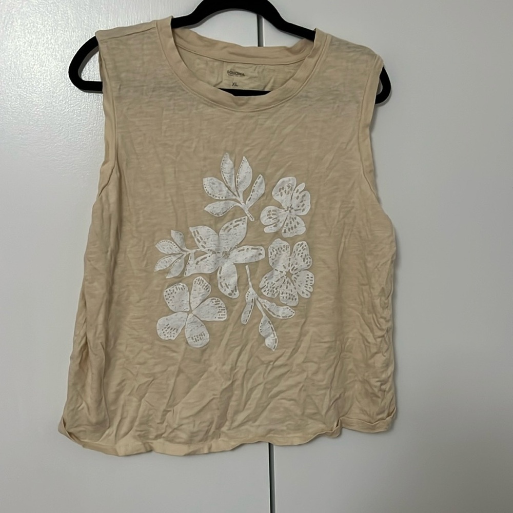 Cream colored muscle top.